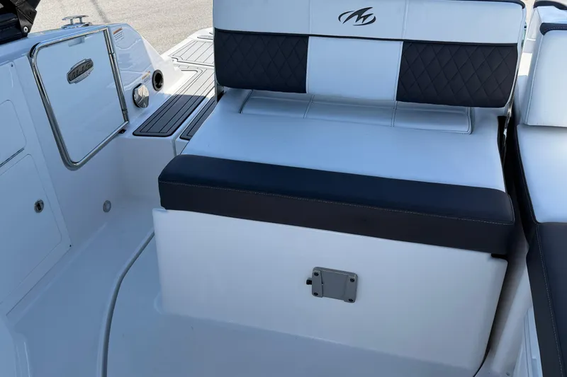 Slide: The Image of 2023 Monterey M-45 boat interior with cushioned seating and sleek design. - 13