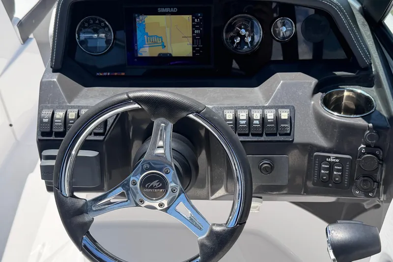 Slide: The Image of Dashboard of 2023 Monterey M-45 boat with steering wheel and navigation display. - 17