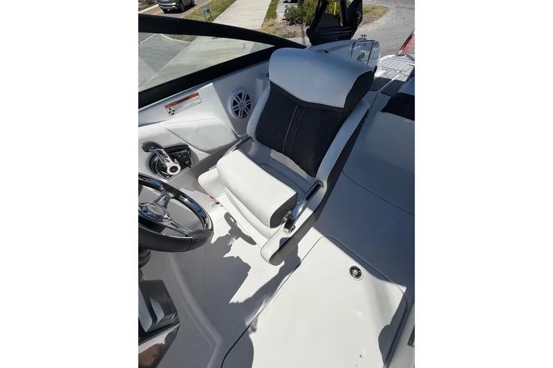 Slide: The Image of Captain's seat and helm of 2023 Monterey M-45 boat, featuring sleek design and controls. - 23