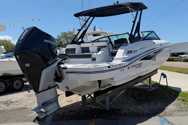 Slide: The Image of 2023 Monterey M-45 boat with Mercury V8 engine, displayed outdoors on a stand. - 4