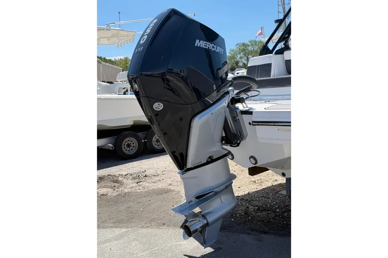 Slide: The Image of 2023 Monterey M-45 boat with Mercury outboard motor, parked on a trailer. - 7