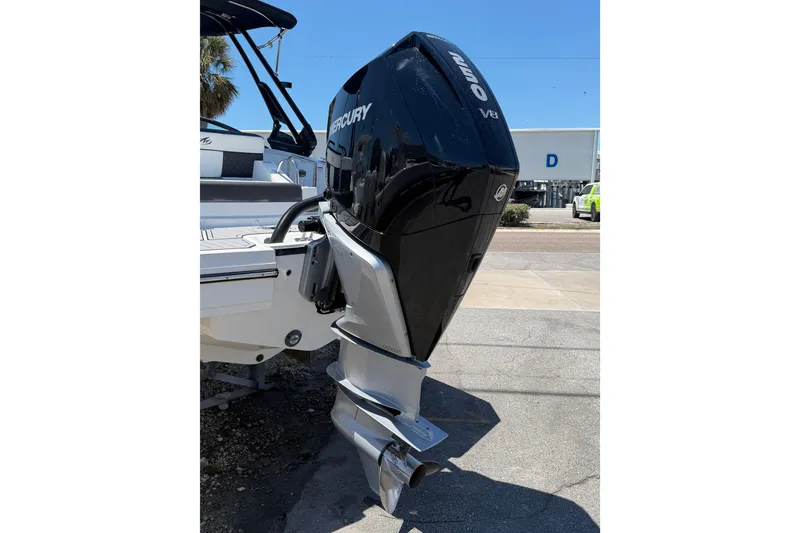 Slide: The Image of 2023 Monterey M-45 boat with a Mercury V8 outboard engine, parked outdoors. - 8