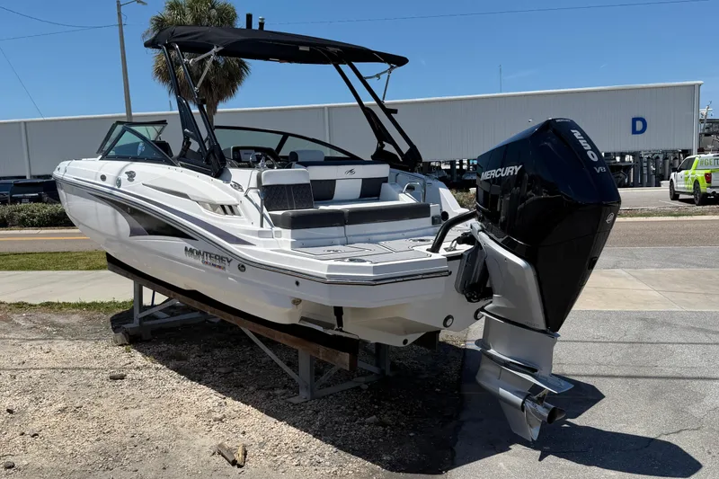 Slide: The Image of 2023 Monterey M-45 boat with Mercury V8 engine on display outdoors. - 9