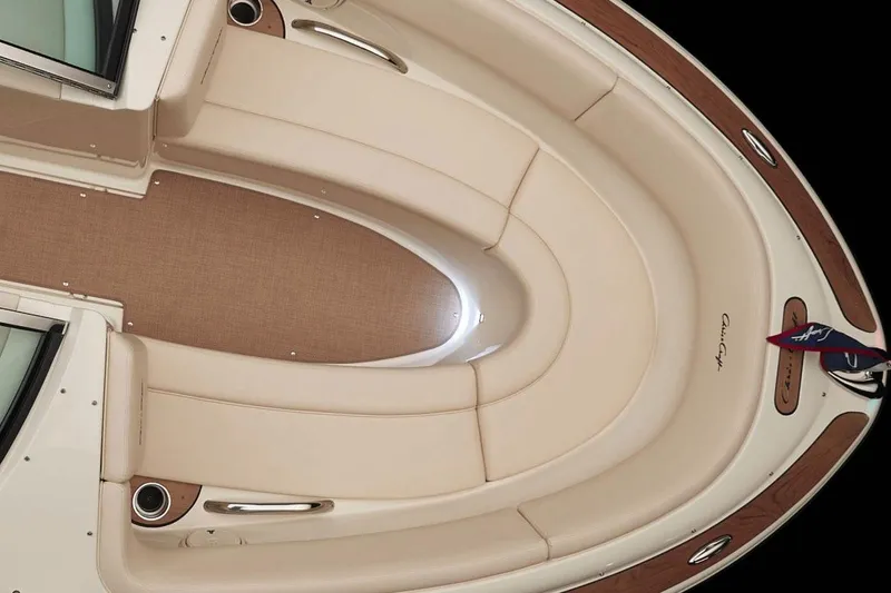 Slide: The Image of 2018 Chris-Craft Launch 23 boat on trailer, parked near a metal building. - 4