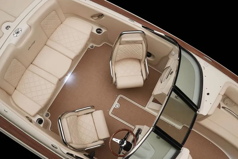 Slide: The Image of 2018 Chris-Craft Launch 23 boat on trailer, parked outdoors near a building. - 5