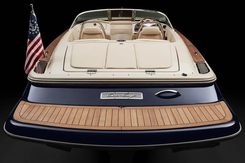 Slide: The Image of 2018 Chris-Craft Launch 23 boat with wooden deck, parked outdoors. - 8