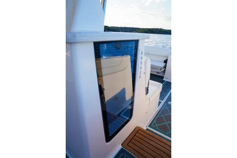 Slide: The Image of 2021 Regal 38 SAV boat interior with modern seating and sleek design. - 16