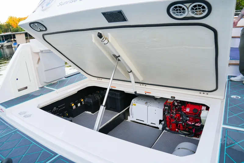 Slide: The Image of Open engine compartment of 2021 Regal 38 SAV boat, showcasing mechanical components. - 22