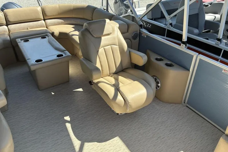 Slide: The Image of Luxurious interior of a 2016 Bennington 22 SSRX pontoon boat with plush seating and cup holders. - 3