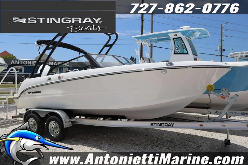 The Image of 2026 Stingray 20 SBX boat on trailer at Antonietti Marine dealership. - 1