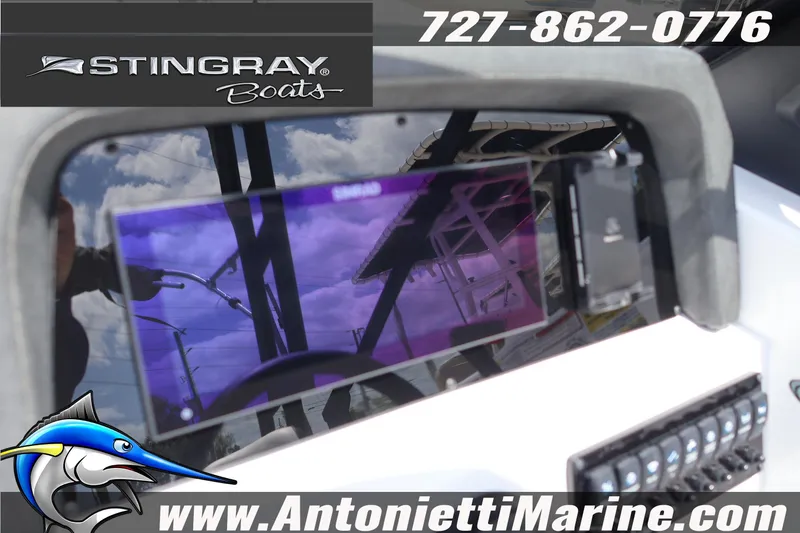 Slide: The Image of 2026 Stingray 20 SBX boat dashboard with electronics, featuring Antonietti Marine branding and contact information. - 11