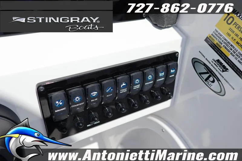 Slide: The Image of Control panel of 2026 Stingray 20 SBX boat with various switches and branding. - 12