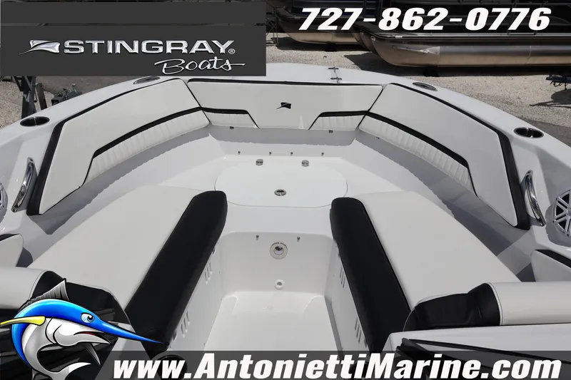 Slide: The Image of 2026 Stingray 20 SBX boat interior with white and black seating, displayed at Antonietti Marine. - 19