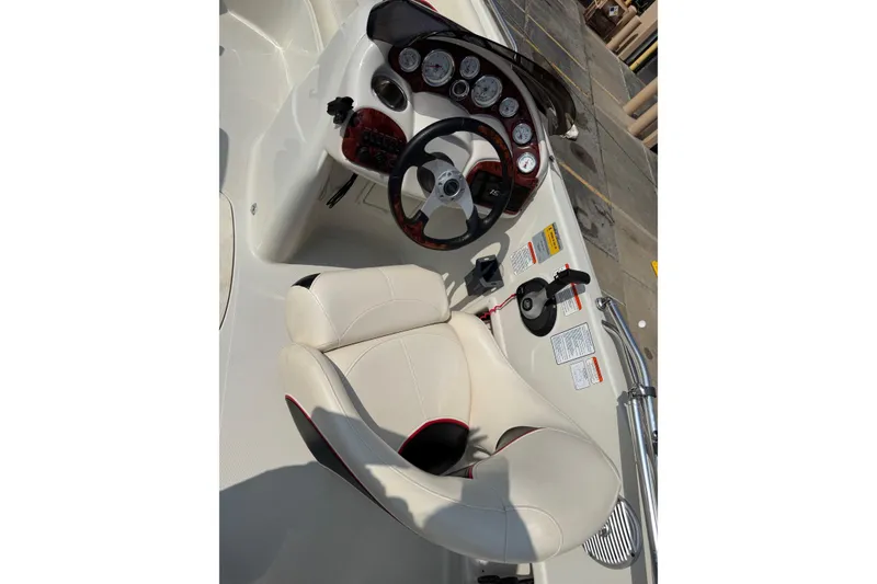 Slide: The Image of 2013 Tahoe 195 I/O boat cockpit with steering wheel and gauges. - 6