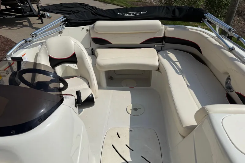 Slide: The Image of 2013 Tahoe 195 I/O boat interior with white seating and steering wheel. - 7