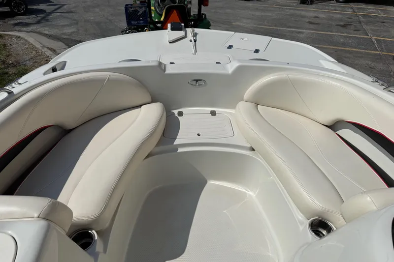Slide: The Image of 2013 Tahoe 195 I/O boat interior with white seating and cup holders. - 8
