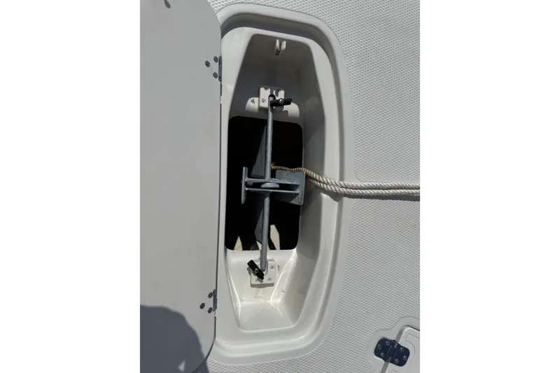 Slide: The Image of Anchor compartment of a 2013 Tahoe 195 I/O boat with rope and hardware. - 9