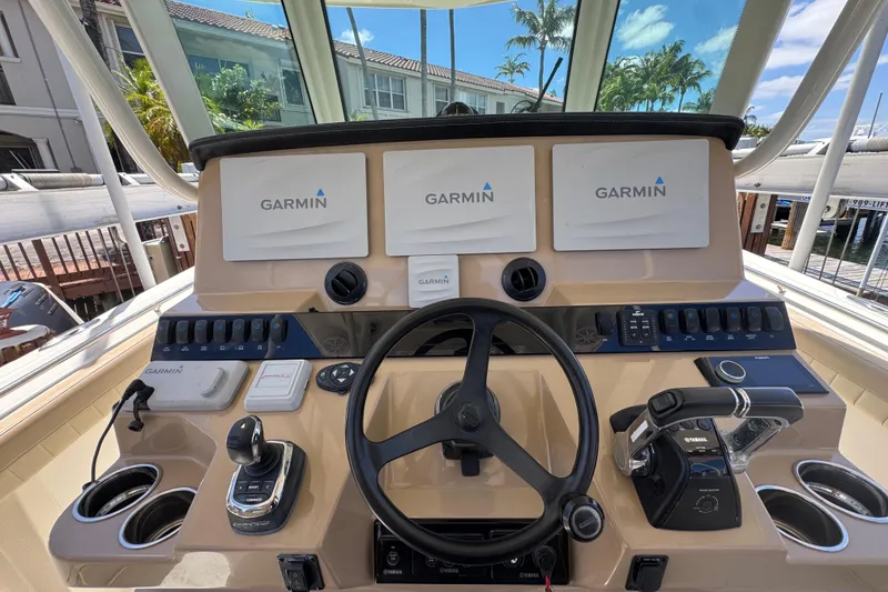 Slide: The Image of 2019 Sailfish 360 CC helm with Garmin displays and Yamaha controls. - 22