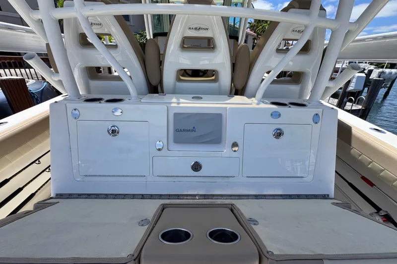 Slide: The Image of 2019 Sailfish 360 CC boat interior with Garmin equipment and seating arrangement. - 29