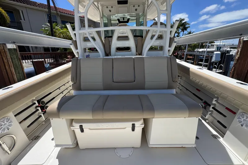 Slide: The Image of 2019 Sailfish 360 CC boat interior with cushioned seating and storage. - 31