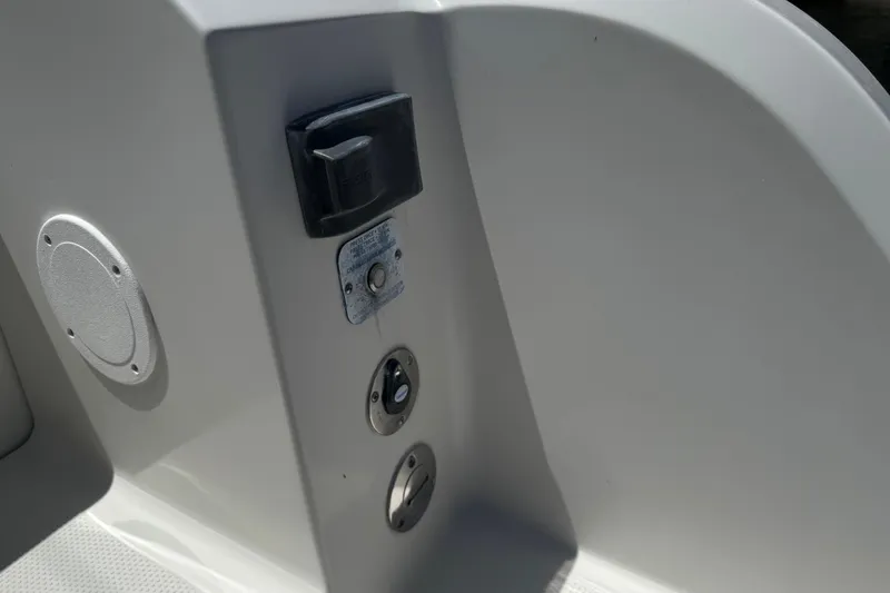 Slide: The Image of 2019 Sailfish 360 CC boat interior detail with control panel and speaker. - 40