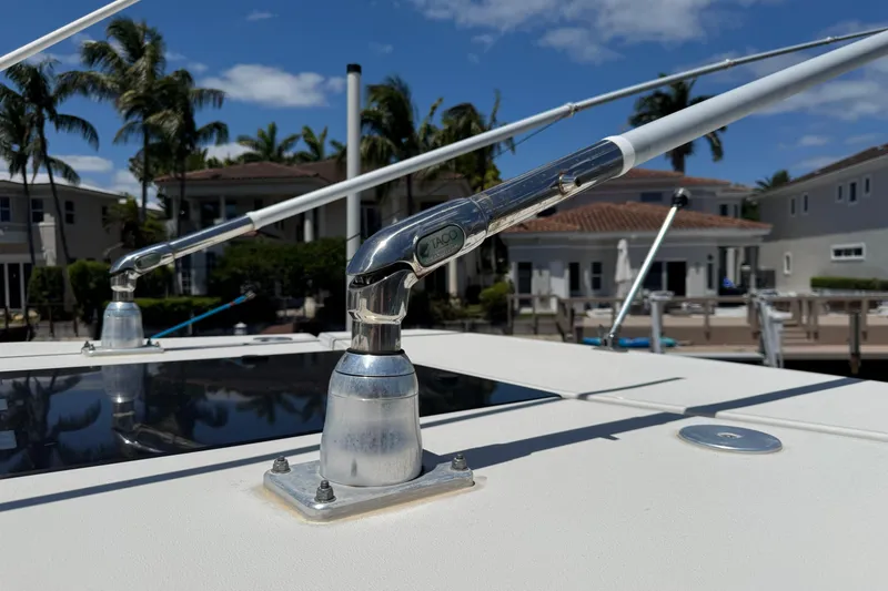 Slide: The Image of Close-up of a 2019 Sailfish 360 CC boat's metal fittings against a waterfront backdrop. - 41