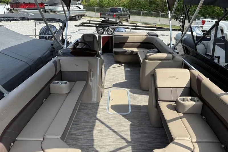 Slide: The Image of 2022 Bennington 22 SLX pontoon boat interior with spacious seating and cup holders. - 4