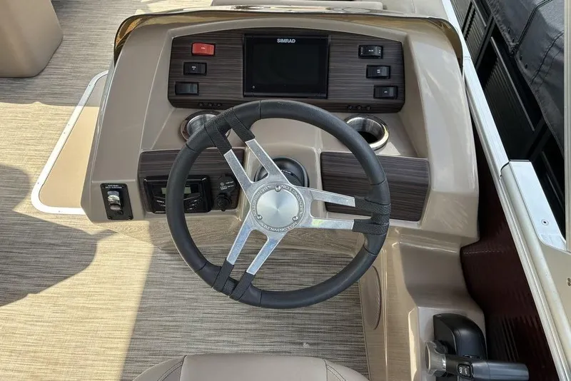Slide: The Image of Steering console of a 2022 Bennington 22 SLX boat with modern controls and display. - 5