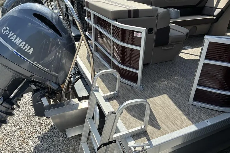 Slide: The Image of 2022 Bennington 22 SLX pontoon boat with Yamaha outboard motor and boarding ladder. - 6
