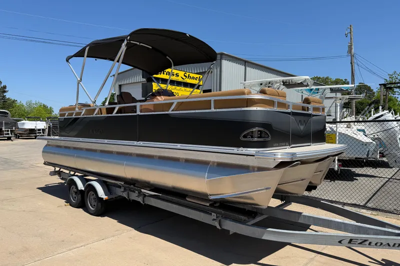 The Image of 2026 Avalon VENTURE QUAD LOUNGE pontoon boat on trailer, outdoor display. - 0