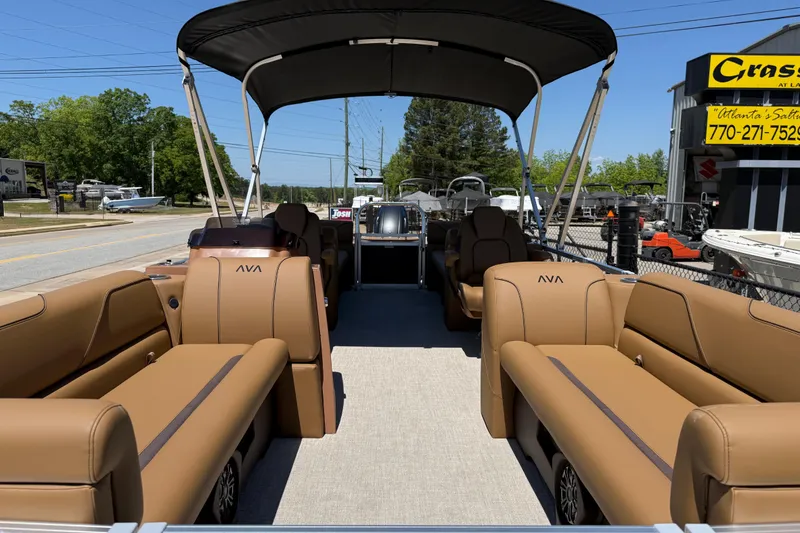 Slide: The Image of 2026 Avalon VENTURE QUAD LOUNGE pontoon boat with tan seating and canopy. - 11