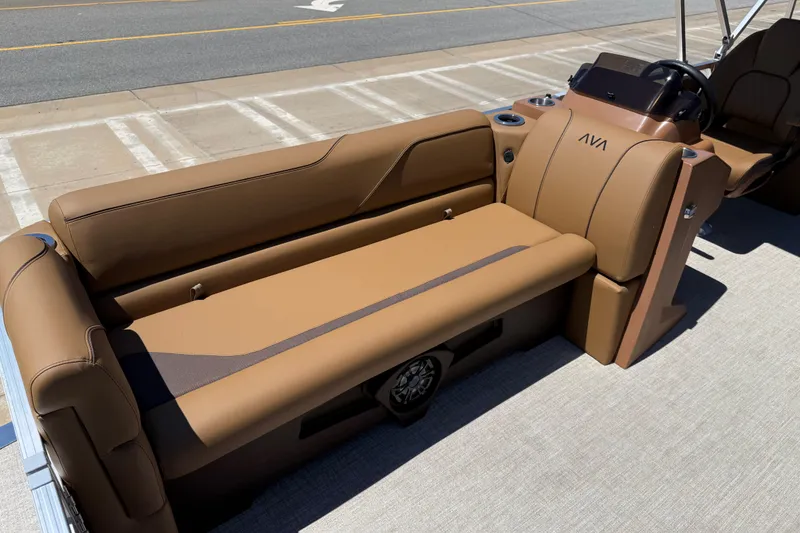 Slide: The Image of 2026 Avalon VENTURE QUAD LOUNGE boat interior with tan seating and steering console. - 13