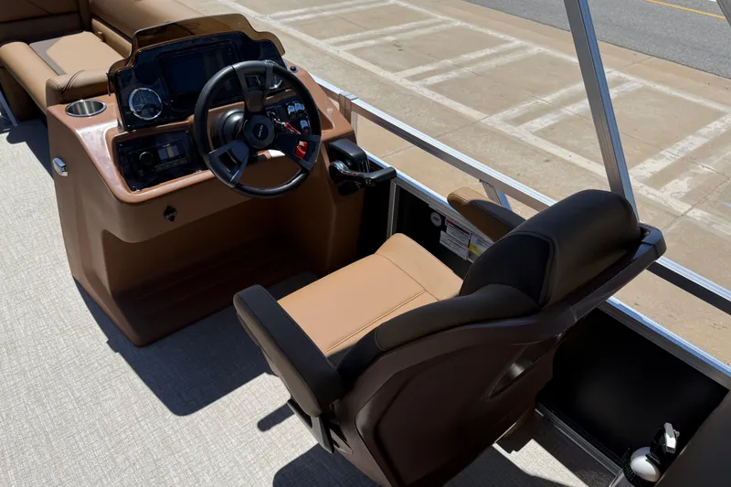 Slide: The Image of 2026 Avalon VENTURE QUAD LOUNGE boat interior with steering console and comfortable seating. - 23