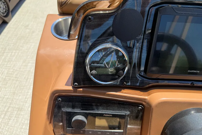 Slide: The Image of Dashboard of 2026 Avalon VENTURE QUAD LOUNGE with Garmin display and RPM gauge. - 26