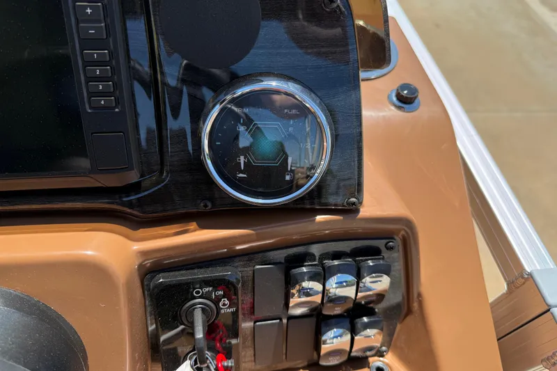 Slide: The Image of Dashboard of 2026 Avalon VENTURE QUAD LOUNGE with fuel gauge and control switches. - 27