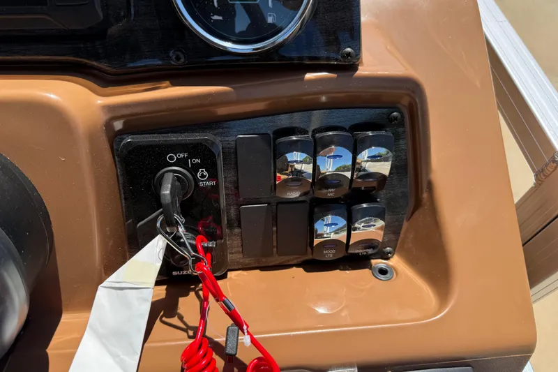 Slide: The Image of Control panel of 2026 Avalon VENTURE QUAD LOUNGE with ignition switch and labeled buttons. - 29