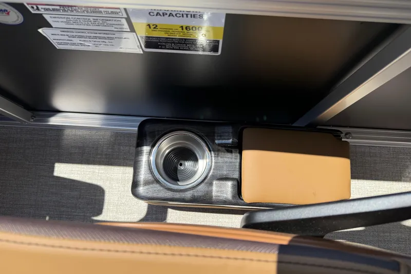 Slide: The Image of Cup holder and armrest in 2026 Avalon VENTURE QUAD LOUNGE boat interior. - 31