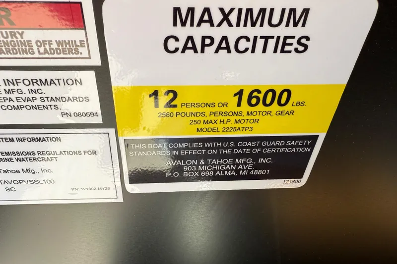 Slide: The Image of 2026 Avalon VENTURE QUAD LOUNGE capacity label: 12 persons, 1600 lbs, US Coast Guard compliant. - 32