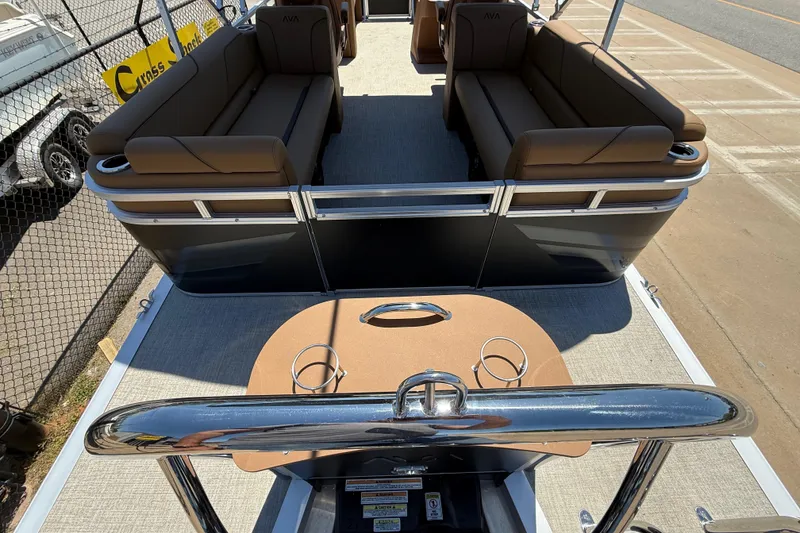 Slide: The Image of 2026 Avalon VENTURE QUAD LOUNGE pontoon boat with brown seating and sleek design. - 36