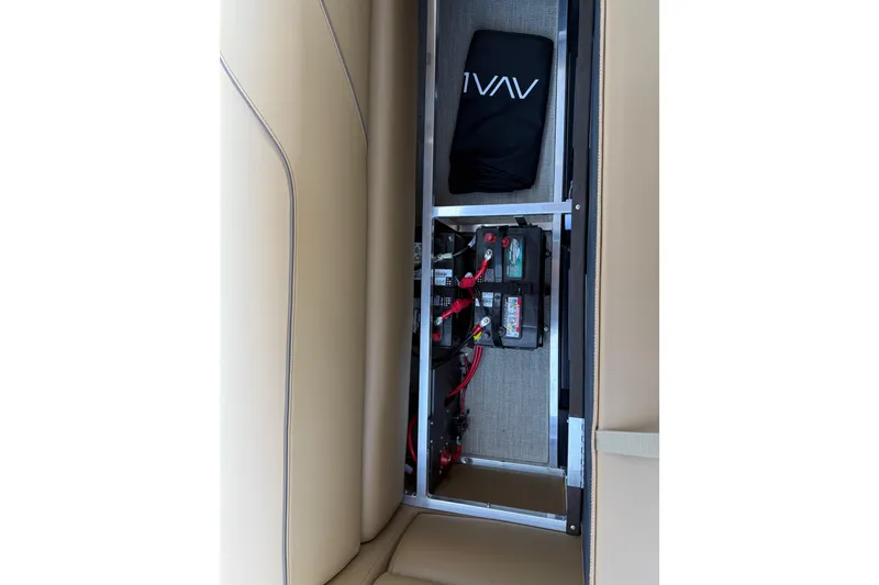 Slide: The Image of 2026 Avalon VENTURE QUAD LOUNGE interior storage with battery compartment and accessories. - 40