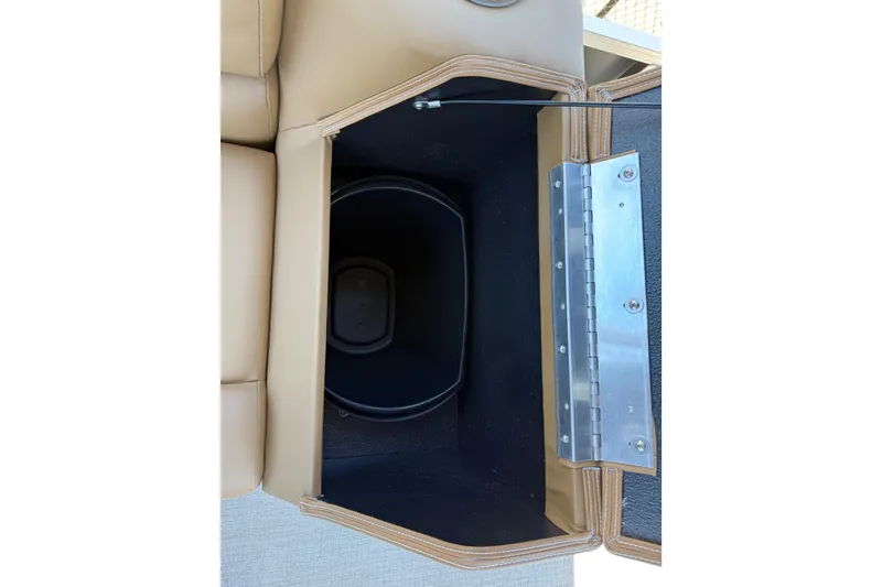 Slide: The Image of 2026 Avalon VENTURE QUAD LOUNGE storage compartment with beige upholstery and metal hinge. - 43