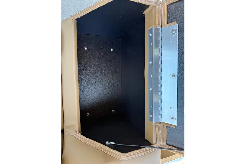 Slide: The Image of Open storage compartment in 2026 Avalon VENTURE QUAD LOUNGE, showcasing interior space and hinge detail. - 44