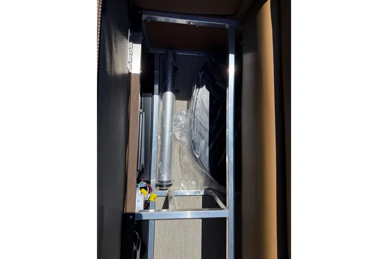 Slide: The Image of Interior view of 2026 Avalon VENTURE QUAD LOUNGE storage compartment with metal frame and components. - 47