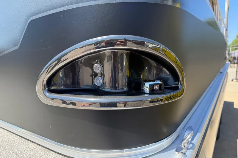 Slide: The Image of Close-up of 2026 Avalon VENTURE QUAD LOUNGE boat detail with chrome trim and lights. - 50