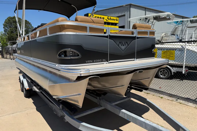 Slide: The Image of 2026 Avalon VENTURE QUAD LOUNGE pontoon boat on trailer, outdoor display. - 52