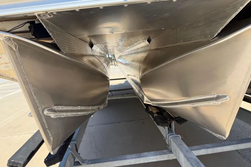 Slide: The Image of Underneath view of 2026 Avalon VENTURE QUAD LOUNGE pontoon boat on trailer. - 53