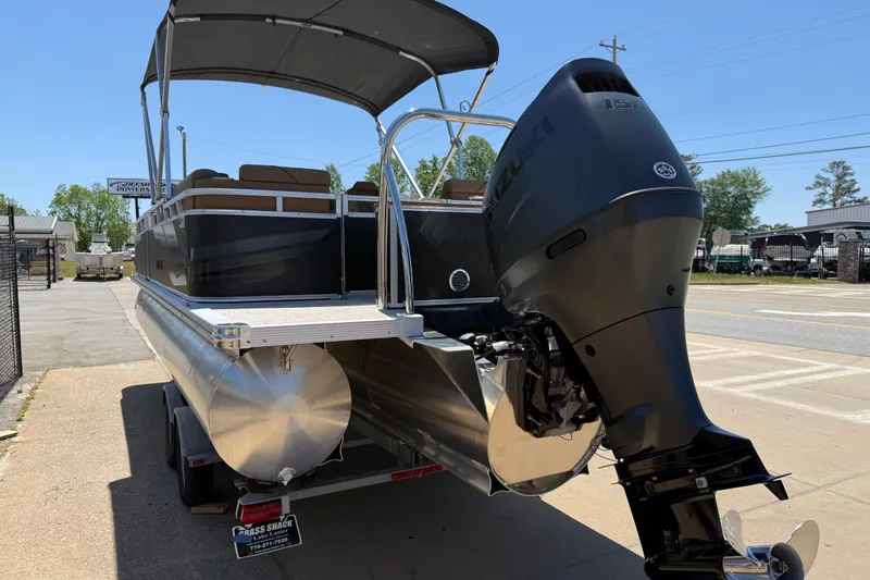 Slide: The Image of 2026 Avalon VENTURE QUAD LOUNGE pontoon boat with Suzuki outboard motor on trailer. - 7
