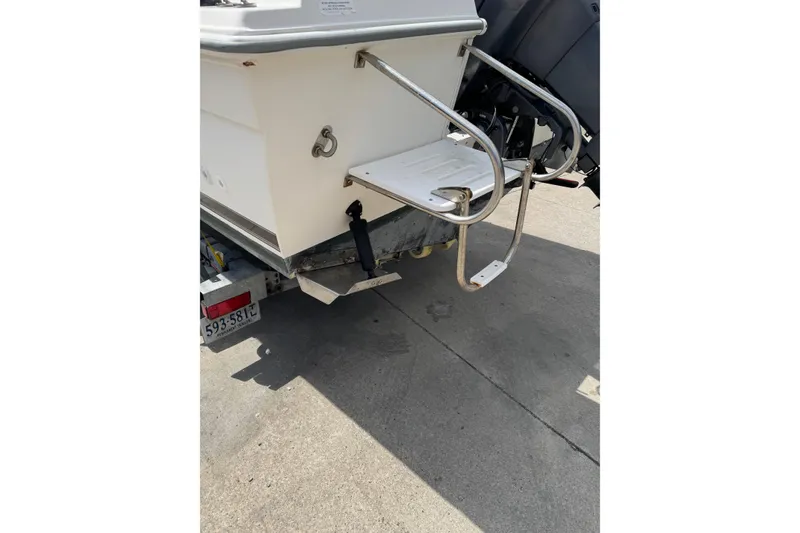 Slide: The Image of Rear view of a 2000 Wellcraft 22 Coastal Walkaround O/B boat on a trailer. - 4
