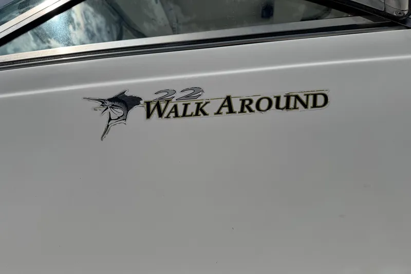 Slide: The Image of 2000 Wellcraft 22 Coastal Walkaround O/B boat logo with marlin graphic. - 5