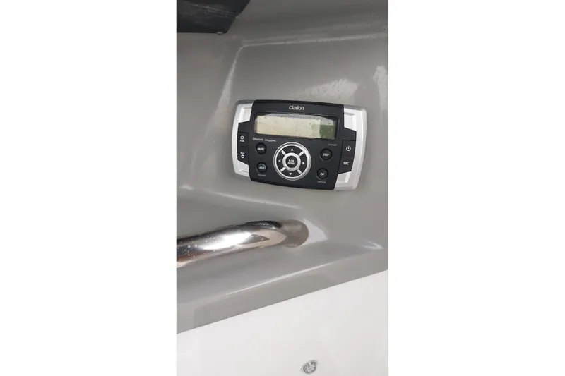 Slide: The Image of Clarion stereo system on 2018 Chaparral 230 Suncoast boat dashboard. - 10